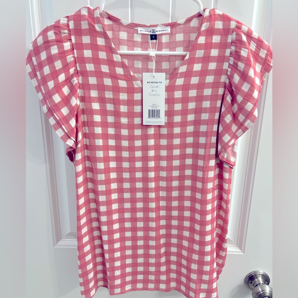 Michelle McDowell pink & white blouse